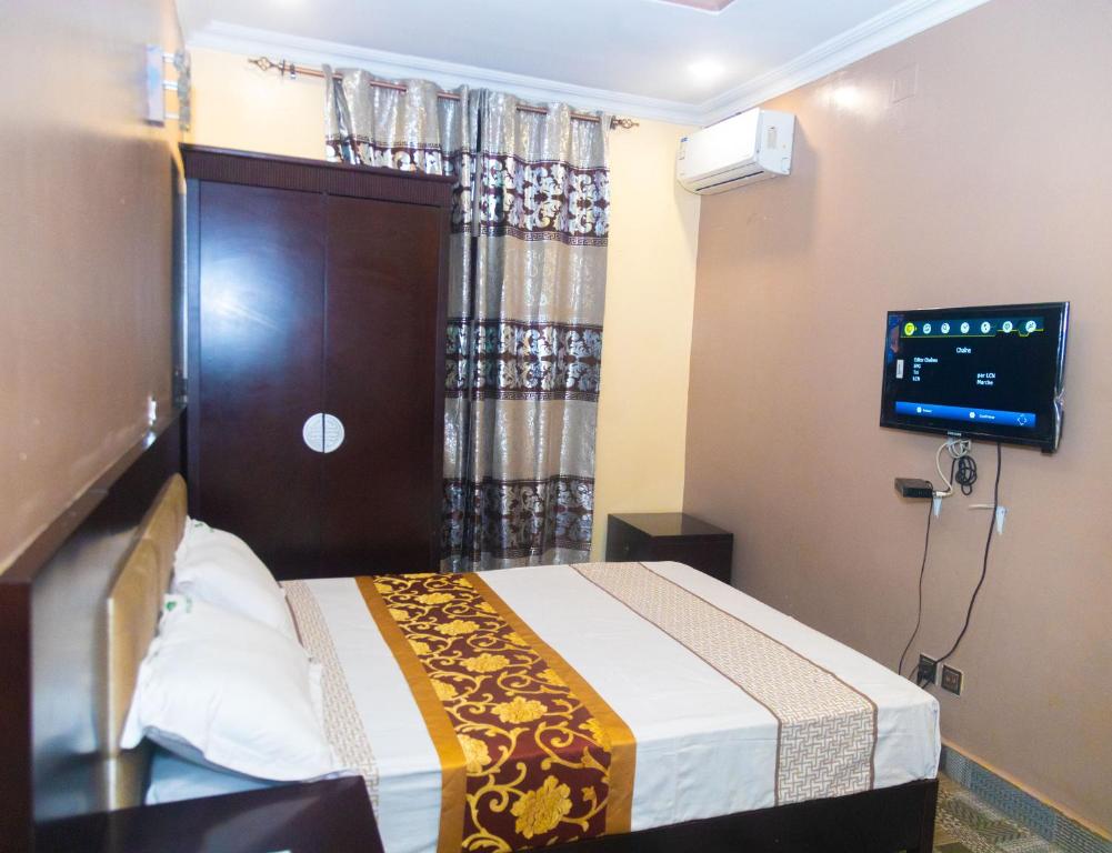 Ένα ή περισσότερα κρεβάτια σε δωμάτιο στο Eden palace