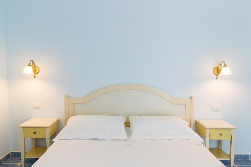 Postel nebo postele na pokoji v ubytování Baia dei Mulini Resort & Spa