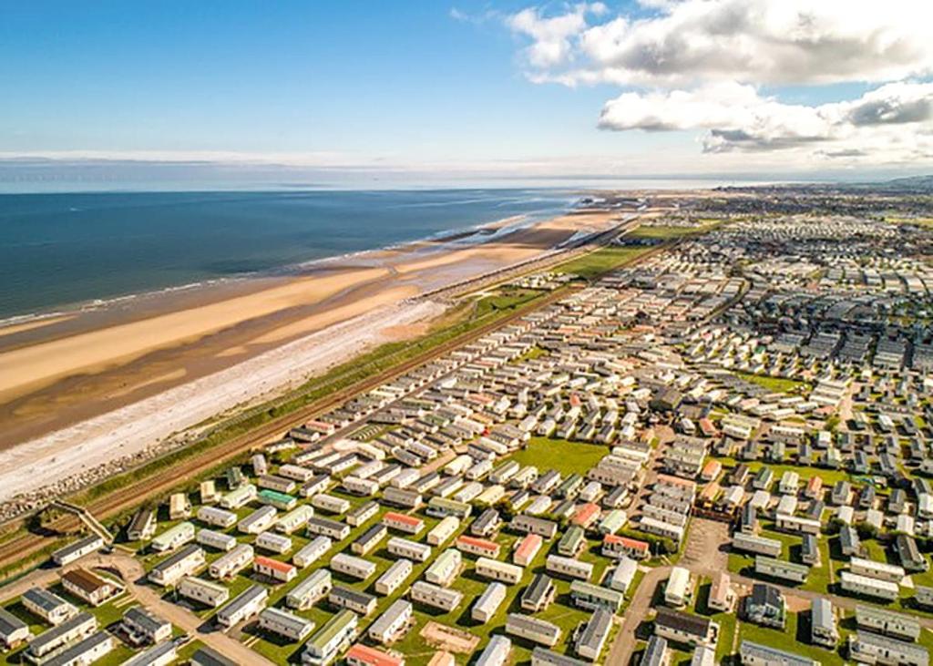 an aerial view of a city next to the beach at Whitehouse Holiday Park in Abergele