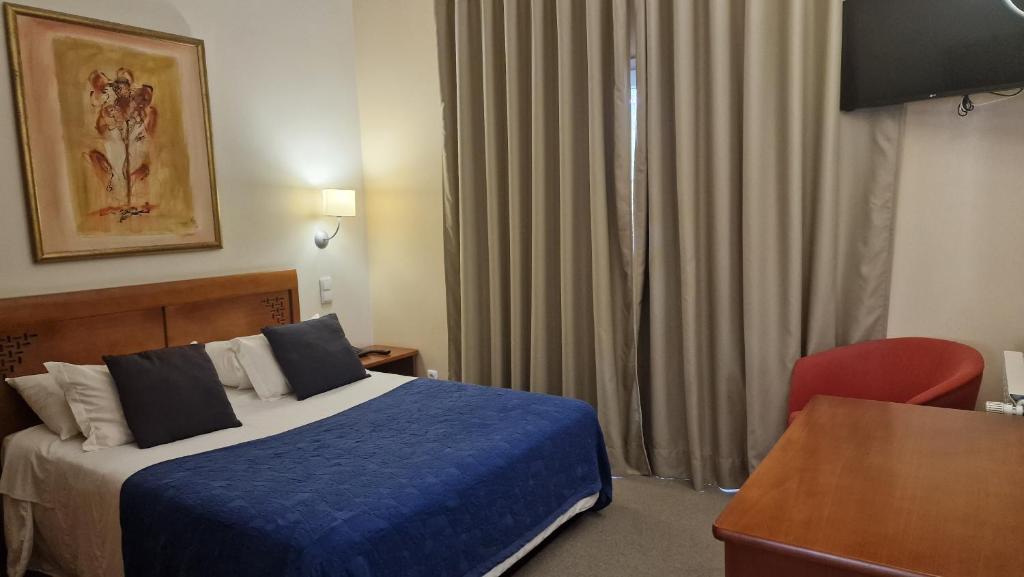 Postel nebo postele na pokoji v ubytování Hotel O Colmo