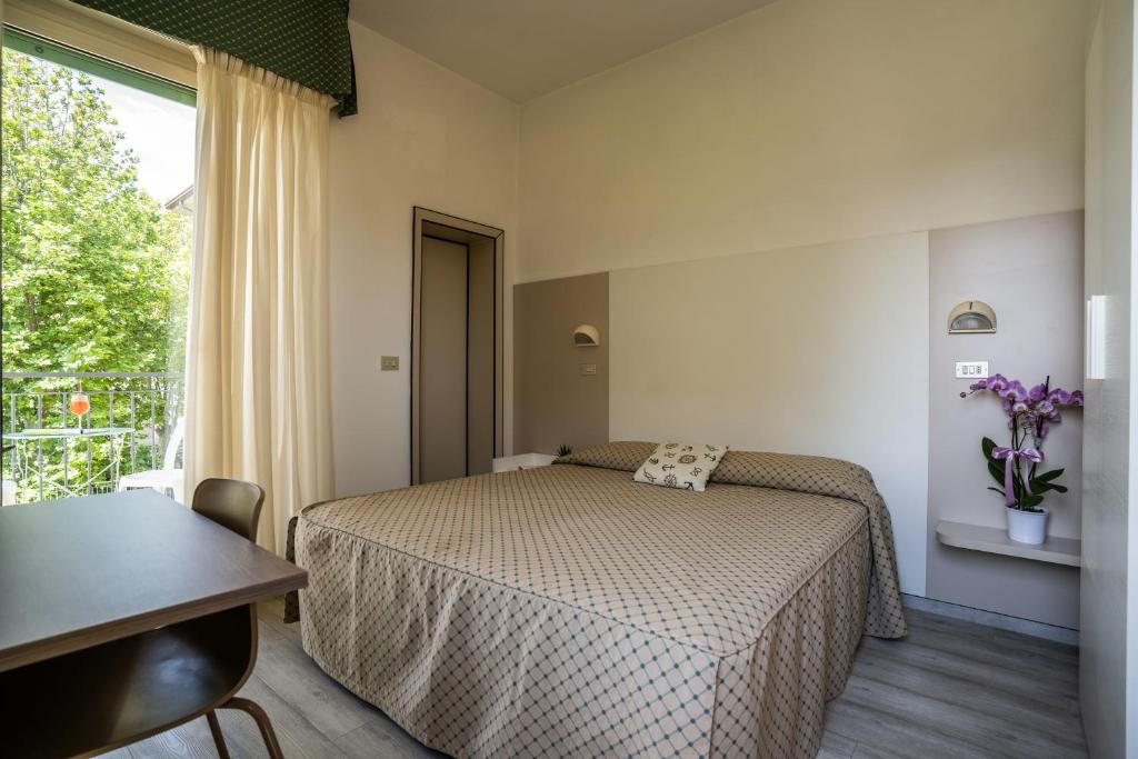 Postel nebo postele na pokoji v ubytování Hotel Marilinda