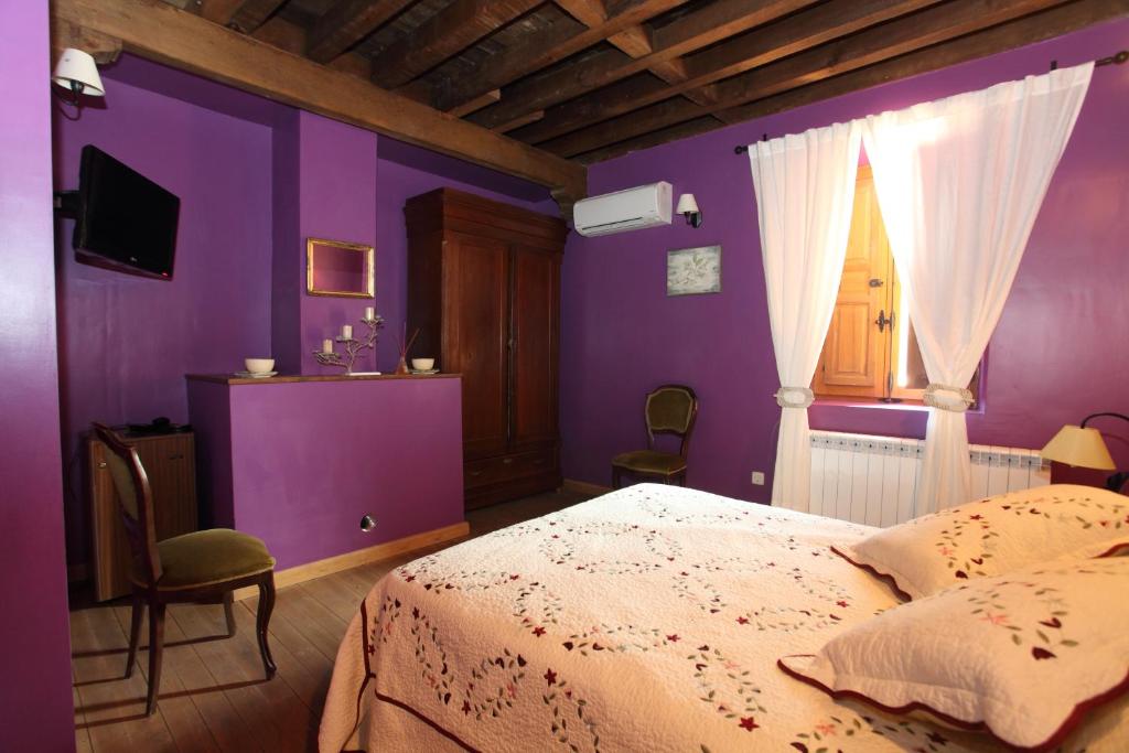 A bed or beds in a room at Posada Villa Maria