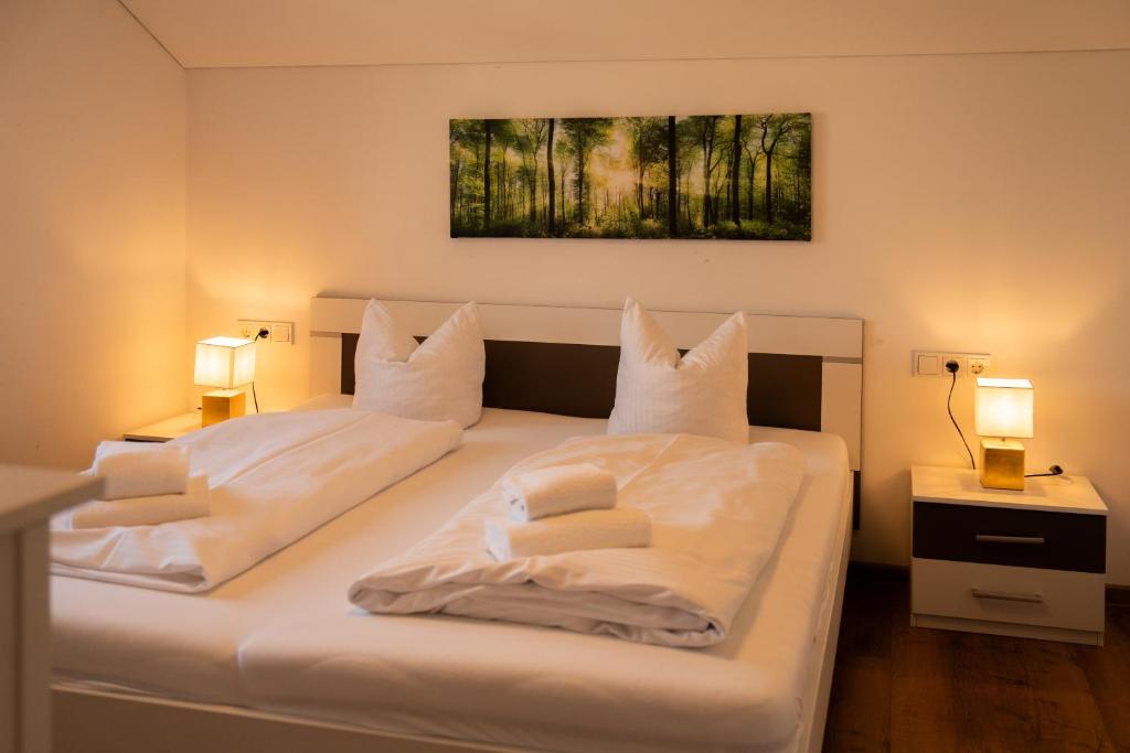 Postel nebo postele na pokoji v ubytování homy Central City Oasis in Dornbirn