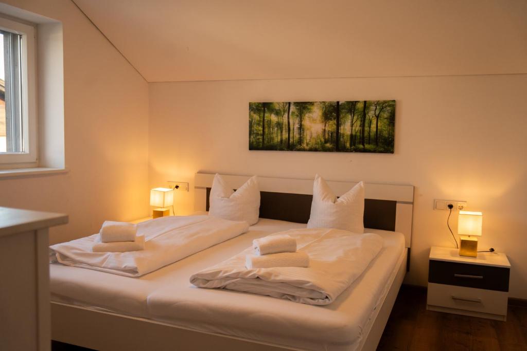 Postel nebo postele na pokoji v ubytování homy Central City Oasis in Dornbirn