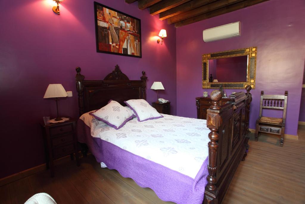 A bed or beds in a room at Posada Villa Maria