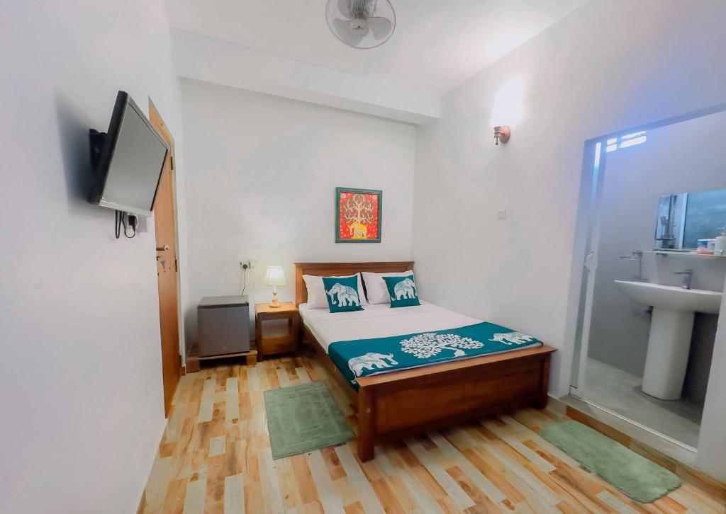 Postel nebo postele na pokoji v ubytování The Kandy Home & City mirror Hostel