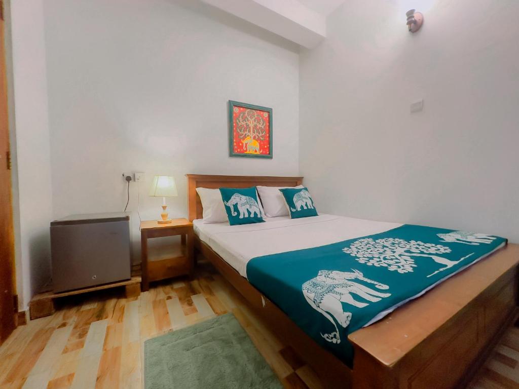 Postel nebo postele na pokoji v ubytování The Kandy Home & City mirror Hostel