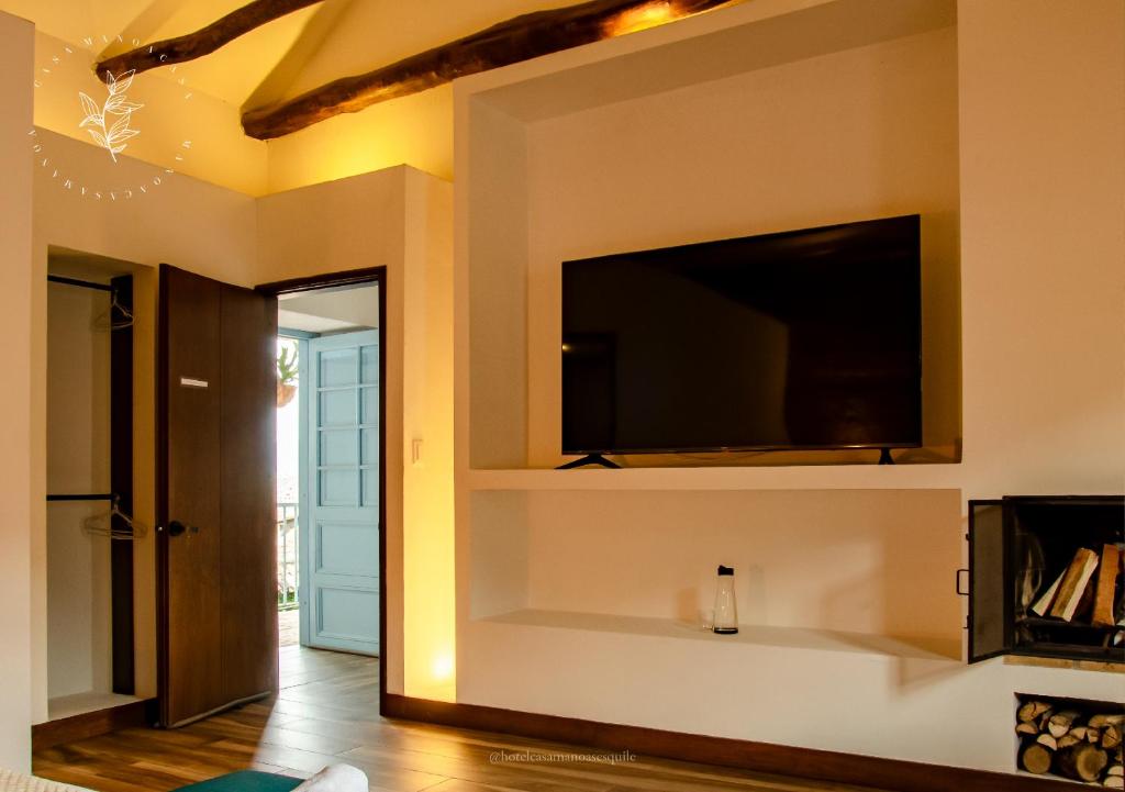 TV a/nebo společenská místnost v ubytování Hotel Casa Manoa Sesquile