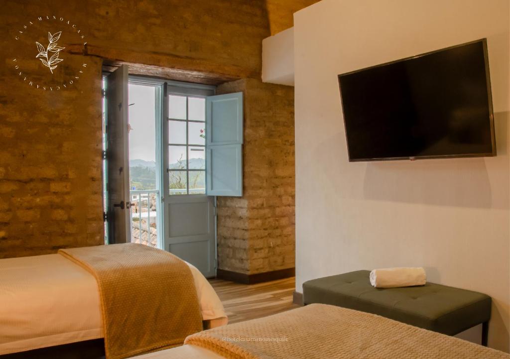 TV a/nebo společenská místnost v ubytování Hotel Casa Manoa Sesquile