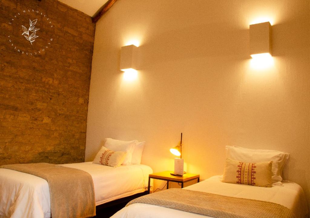 Postel nebo postele na pokoji v ubytování Hotel Casa Manoa Sesquile
