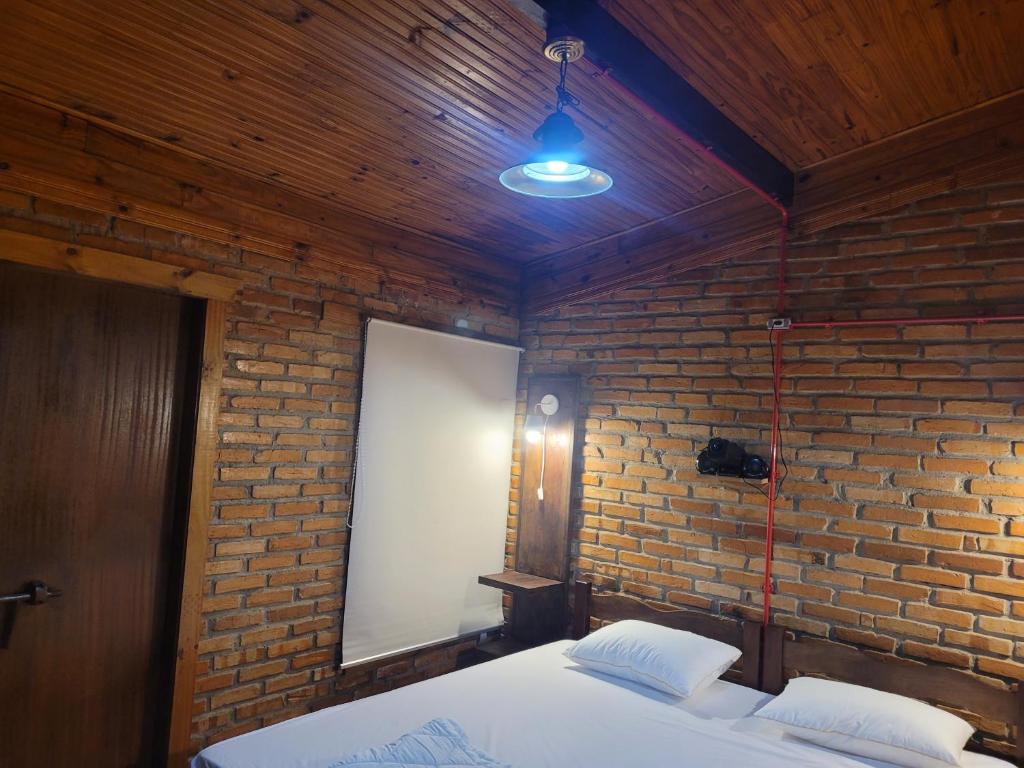 Postel nebo postele na pokoji v ubytování Pousada Alto Pirapitinga