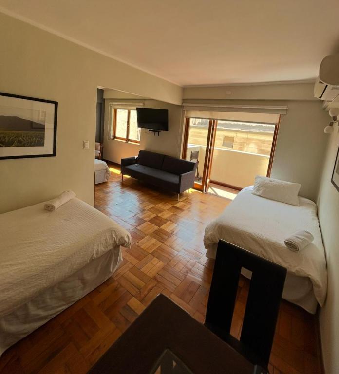 Postel nebo postele na pokoji v ubytování Hotel Plaza Ñuñoa