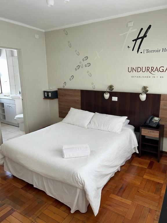 Postel nebo postele na pokoji v ubytování Hotel Plaza Ñuñoa