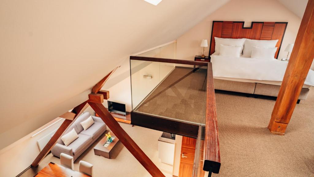 Postel nebo postele na pokoji v ubytování Boutique Hotel Klarov