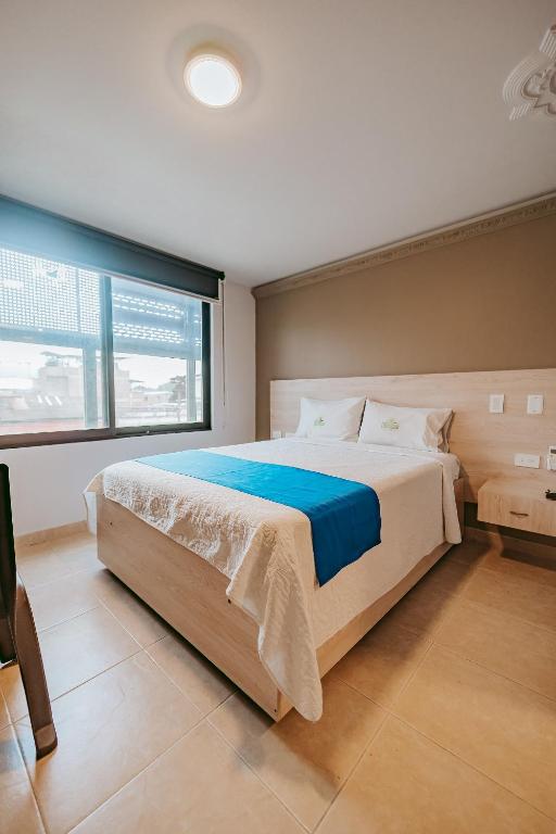 Postel nebo postele na pokoji v ubytování HOTEL VERANO
