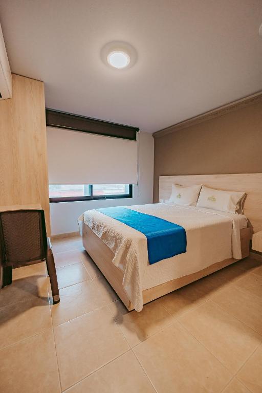 Postel nebo postele na pokoji v ubytování HOTEL VERANO