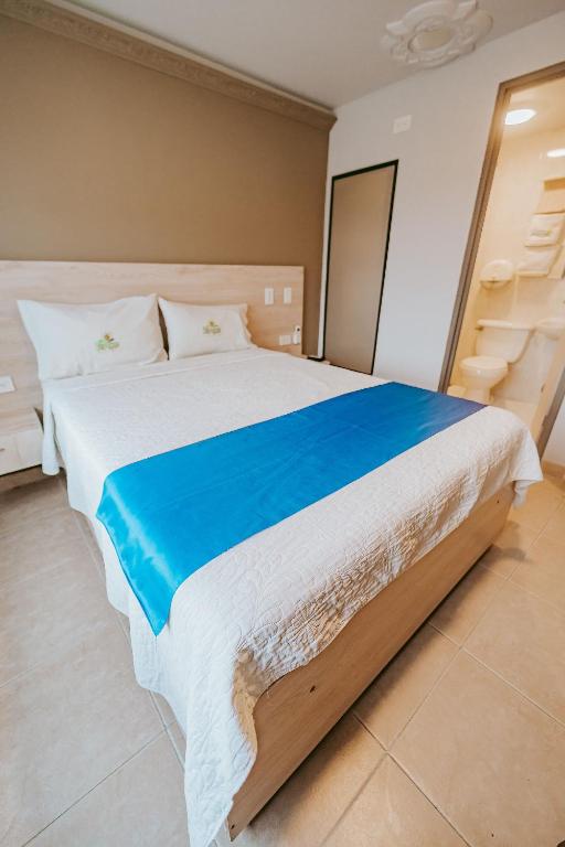 Postel nebo postele na pokoji v ubytování HOTEL VERANO