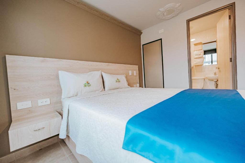 Postel nebo postele na pokoji v ubytování HOTEL VERANO