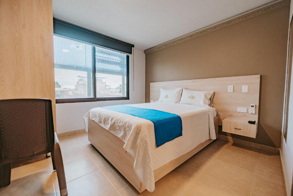 Postel nebo postele na pokoji v ubytování HOTEL VERANO