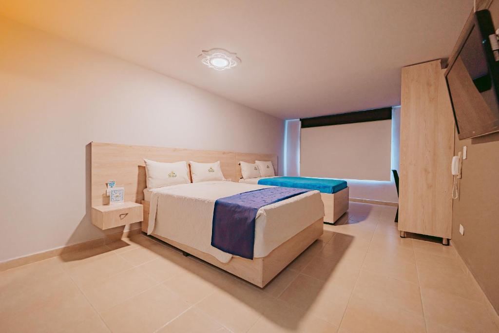 Postel nebo postele na pokoji v ubytování HOTEL VERANO