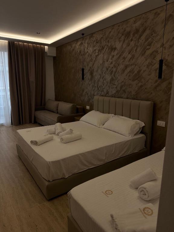 Postel nebo postele na pokoji v ubytování Moonlight Hotel