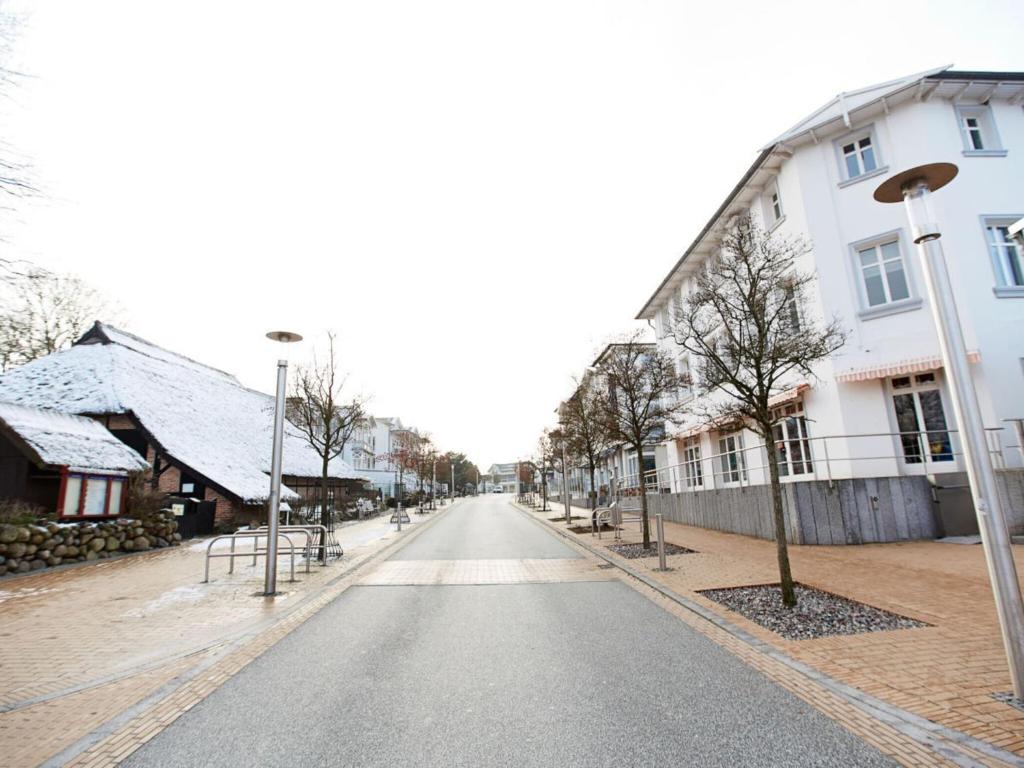 an empty street in a town with buildings at Strandeck Comfortable holiday residence in Göhren