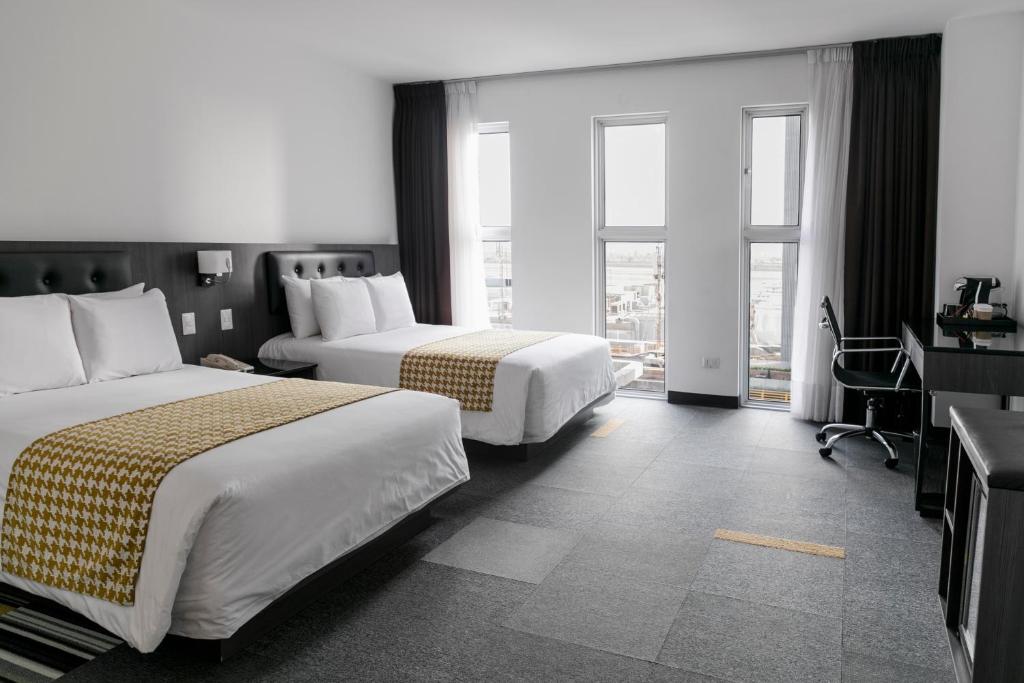 Krevet ili kreveti u jedinici u objektu Wyndham Costa del Sol Lima Airport