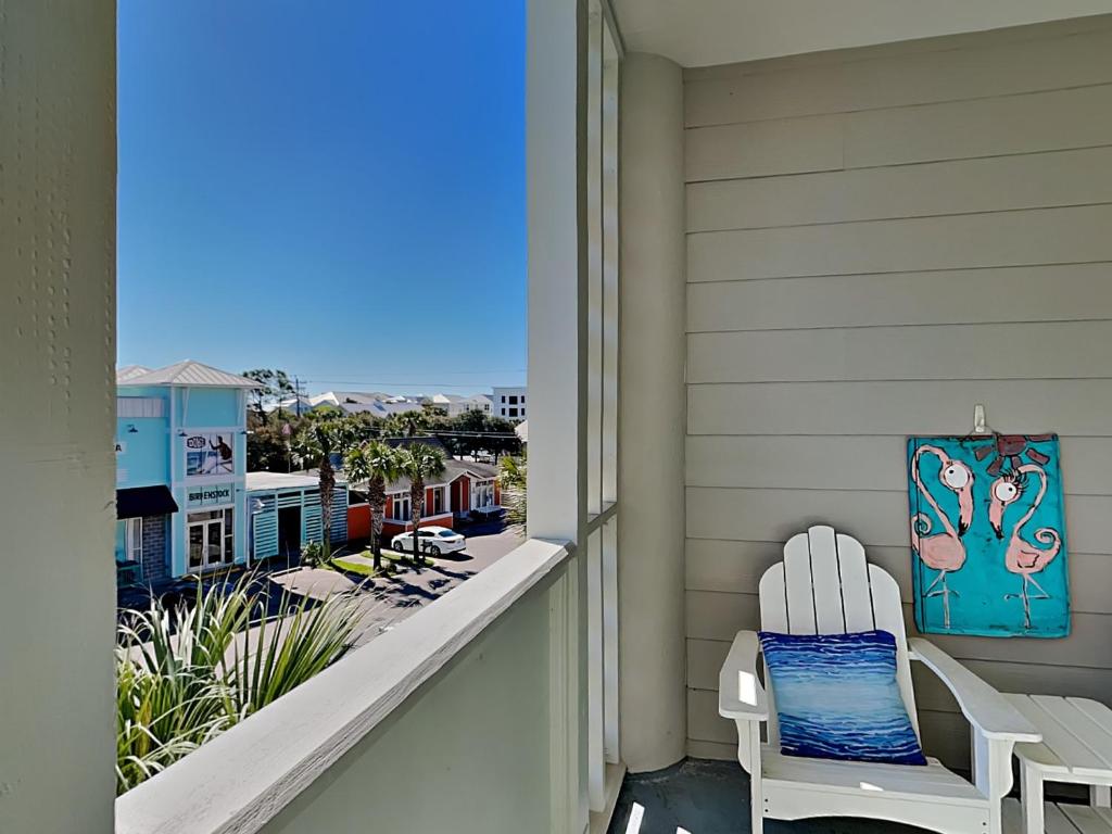 a balcony with a chair and a view of the ocean at Cassine Station 305 - Sea Ya in Santa Rosa Beach