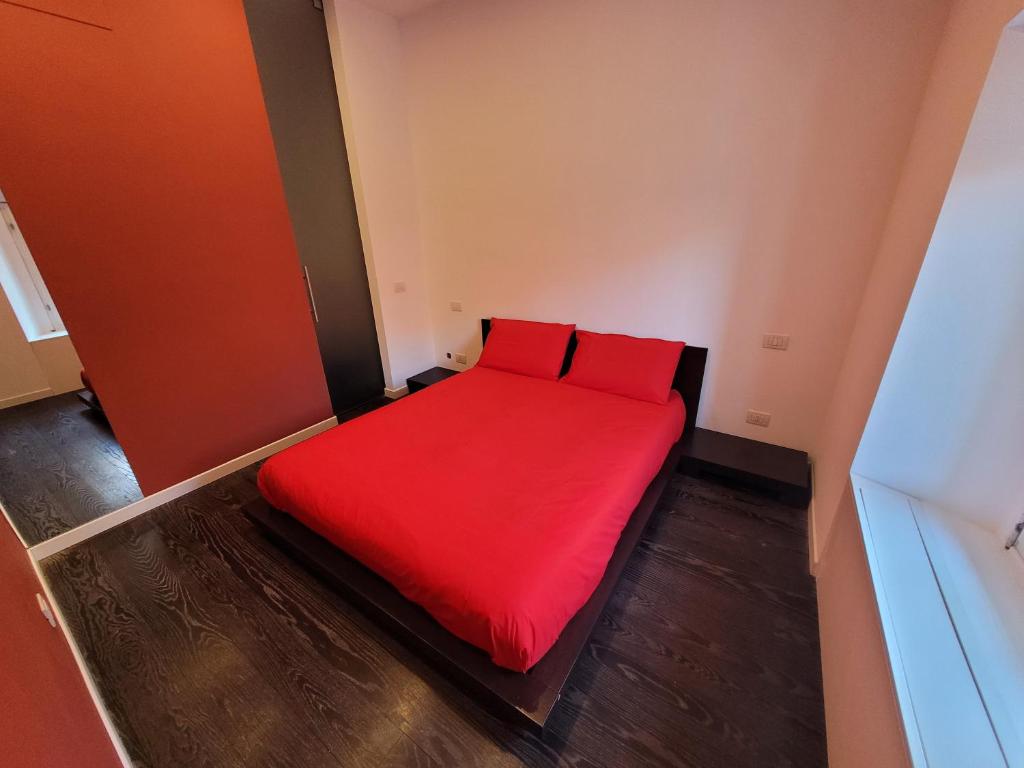 Ένα ή περισσότερα κρεβάτια σε δωμάτιο στο Dolce Rosso Arona