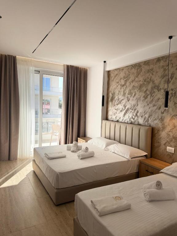 Postel nebo postele na pokoji v ubytování Moonlight Hotel