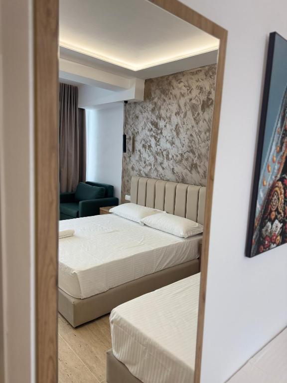Postel nebo postele na pokoji v ubytování Moonlight Hotel