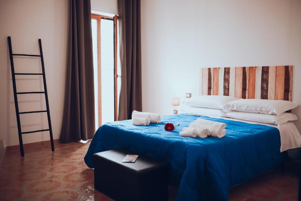 Postel nebo postele na pokoji v ubytování GuestHouse