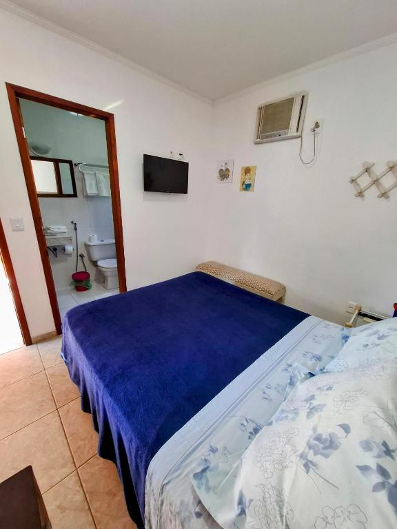 Postel nebo postele na pokoji v ubytování Vila Palmar Hospedagem