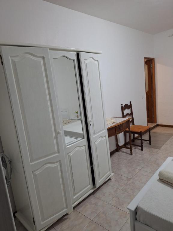 Postel nebo postele na pokoji v ubytování Residencial Vitoria