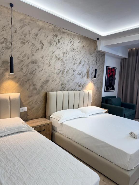 Postel nebo postele na pokoji v ubytování Moonlight Hotel