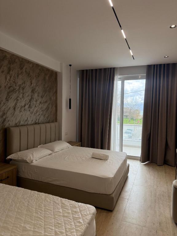 Postel nebo postele na pokoji v ubytování Moonlight Hotel