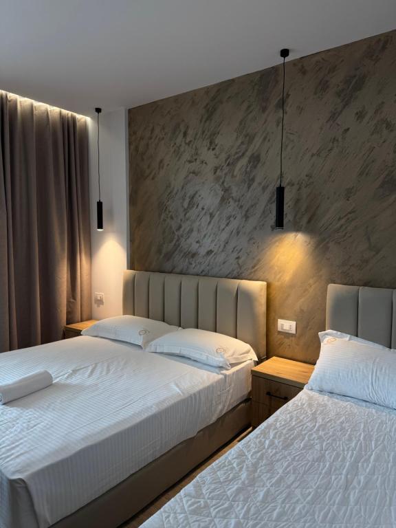 Postel nebo postele na pokoji v ubytování Moonlight Hotel