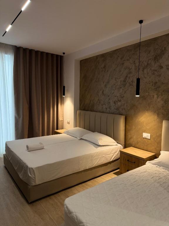 Postel nebo postele na pokoji v ubytování Moonlight Hotel