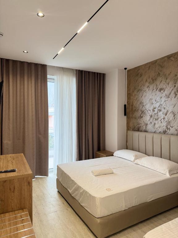 Postel nebo postele na pokoji v ubytování Moonlight Hotel