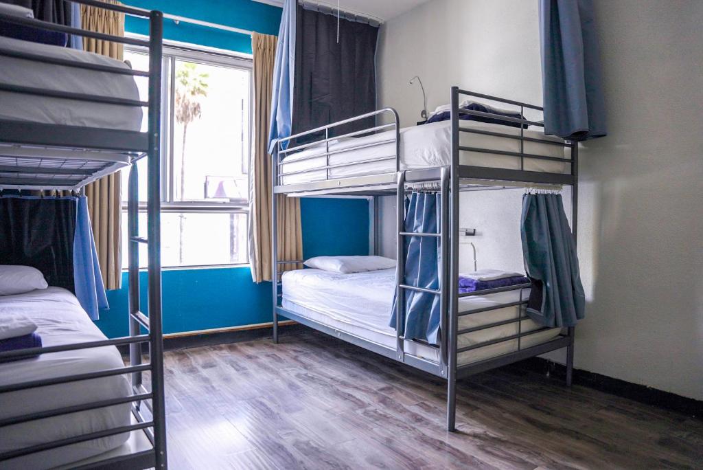 Postel nebo postele na pokoji v ubytování Samesun Hollywood Hotel & Hostel