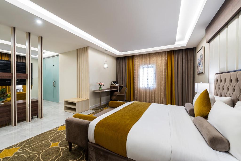 Postel nebo postele na pokoji v ubytování Garden Millennium Hotel