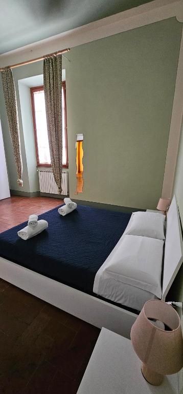 Postel nebo postele na pokoji v ubytování MAGNOLFI Superior