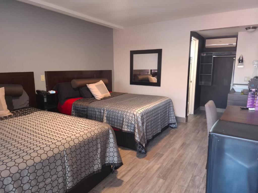 Postel nebo postele na pokoji v ubytování Lizvan Hotel-Motel