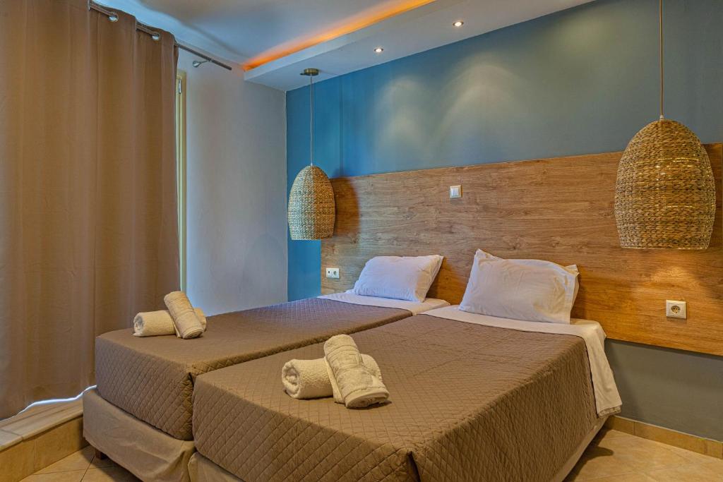 Postel nebo postele na pokoji v ubytování Island Kavos