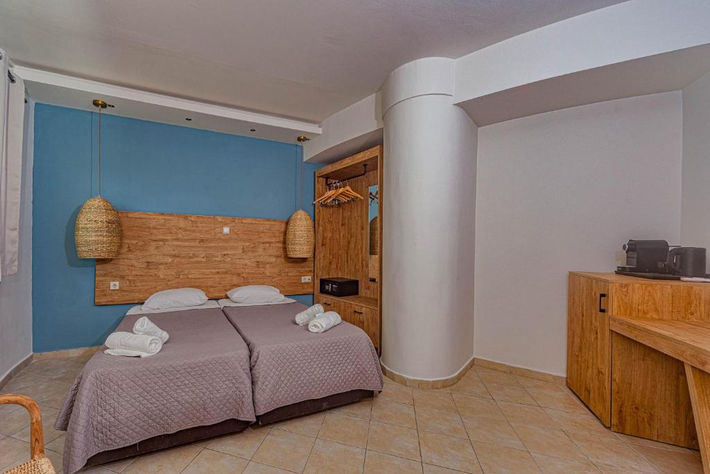 Postel nebo postele na pokoji v ubytování Island Kavos