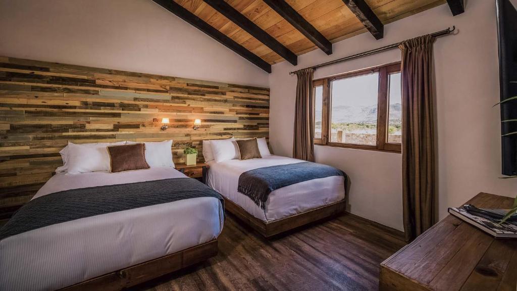 Un pat sau paturi într-o cameră la Hacienda Los Picachos
