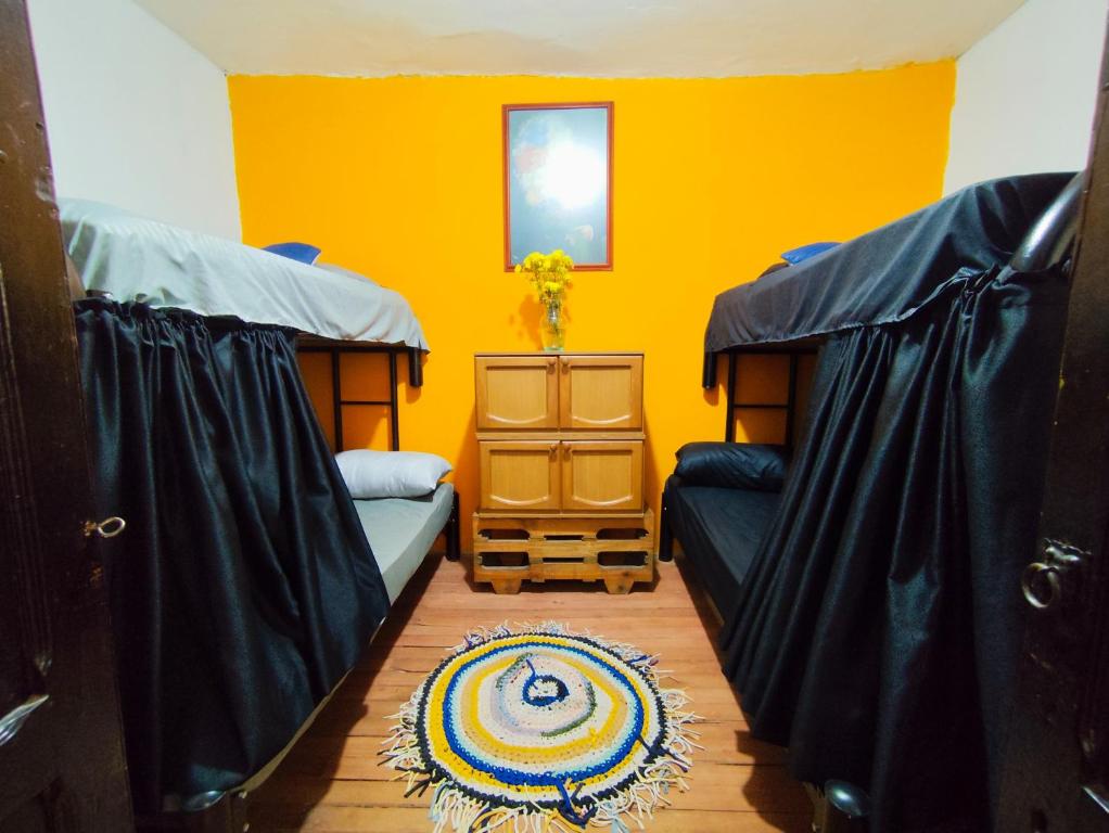Postel nebo postele na pokoji v ubytování Mico Loco Casa Hostal