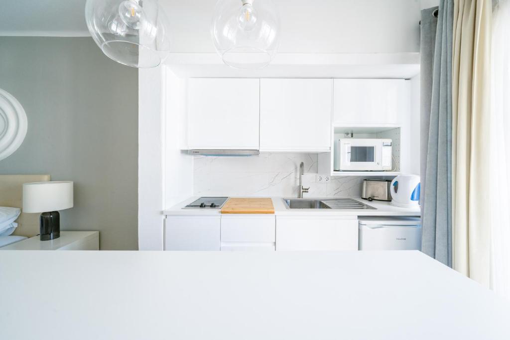 Кухня или мини-кухня в Baluarte da Vila Apartments
