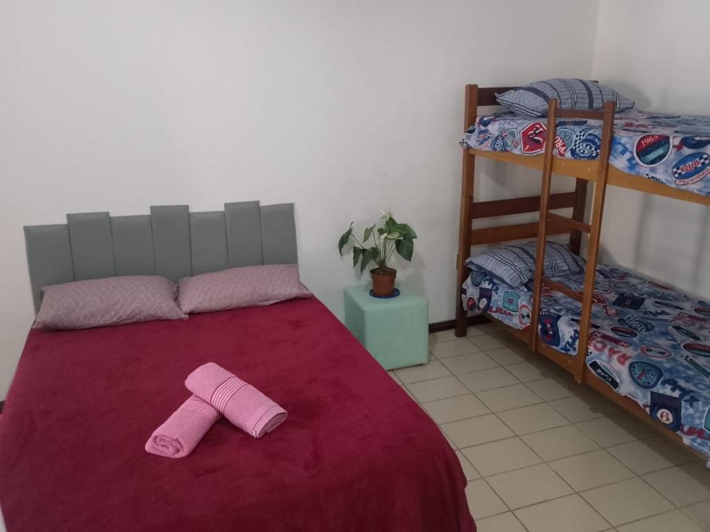 Ένα ή περισσότερα κρεβάτια σε δωμάτιο στο Pousada & Hostel do Tchê