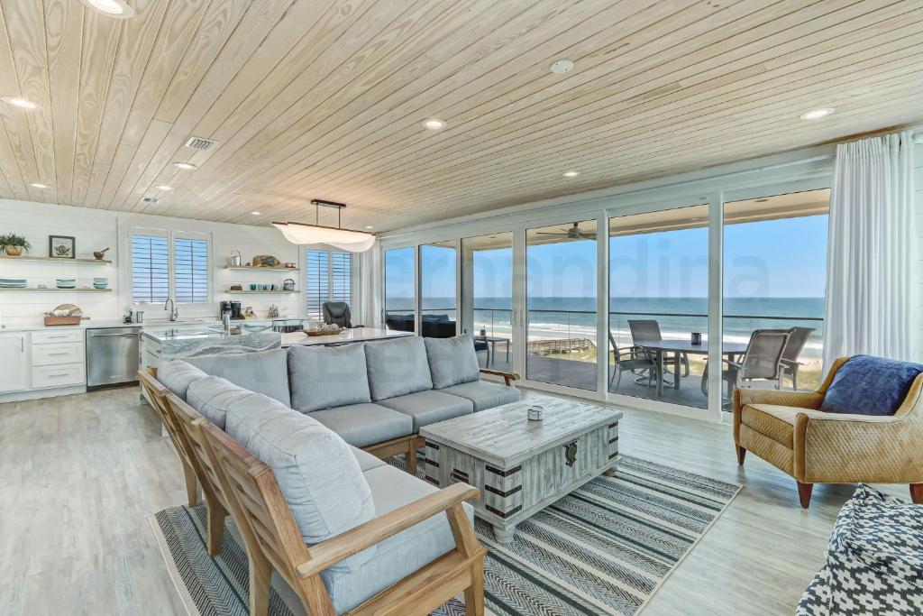 a living room with a couch and a table at 226 South Fletcher 3rd Floor home in Fernandina Beach